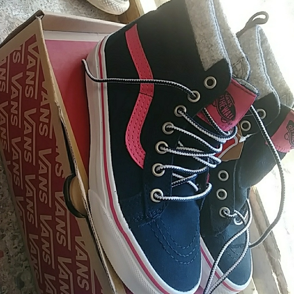 Navy blue ,white, and pink vans